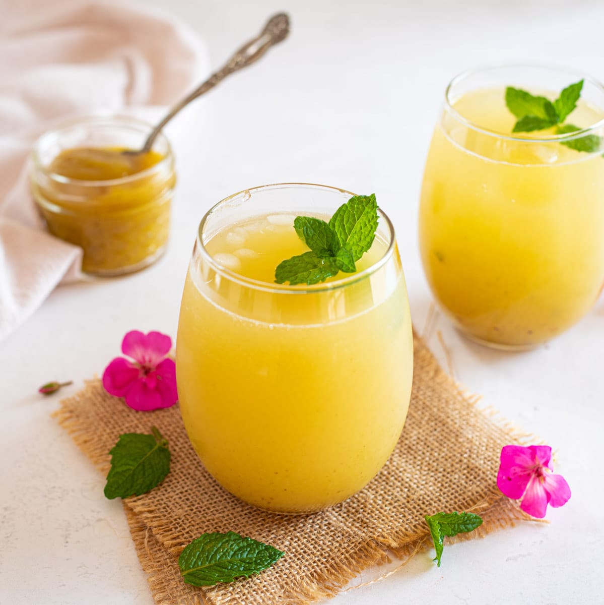 Aam Panna in a glass garnished with mint leaves