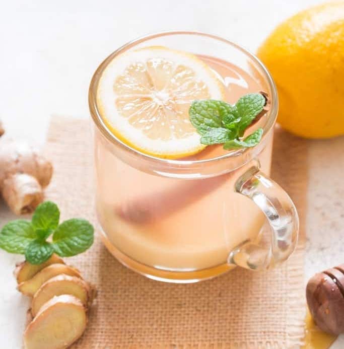 lemon ginger tea with honey in a cup