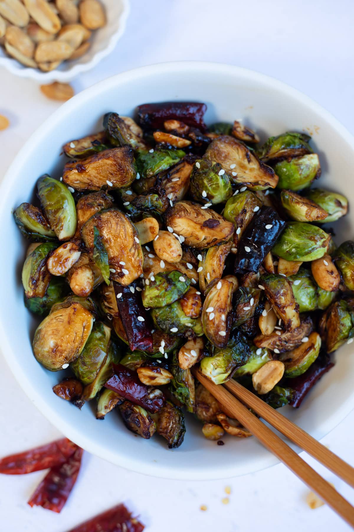 Chinese style Brussels sprouts kung pao in a white bowl