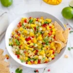 pineapple mango salsa in a bowl with tortilla chips