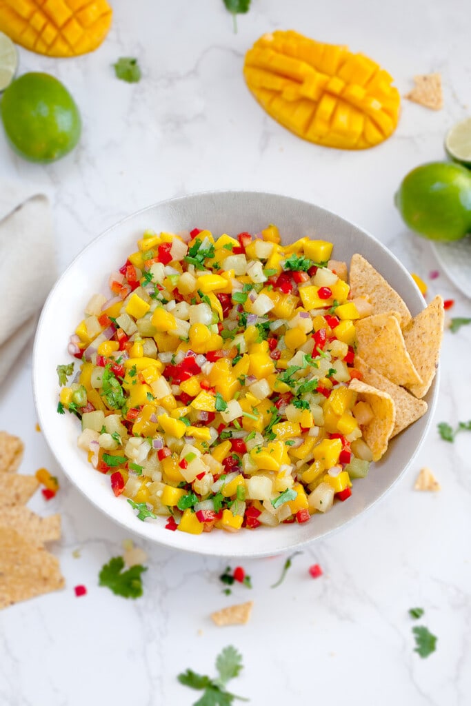pineapple mango salsa in a bowl with tortilla chips 