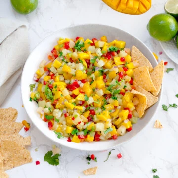 pineapple mango salsa in a bowl with tortilla chips