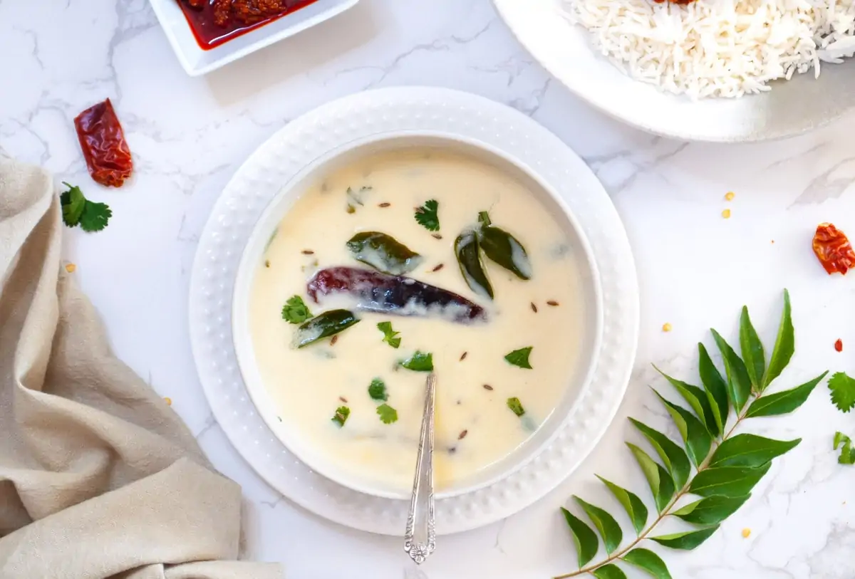 Gujarati Kadhi served in a white bowl