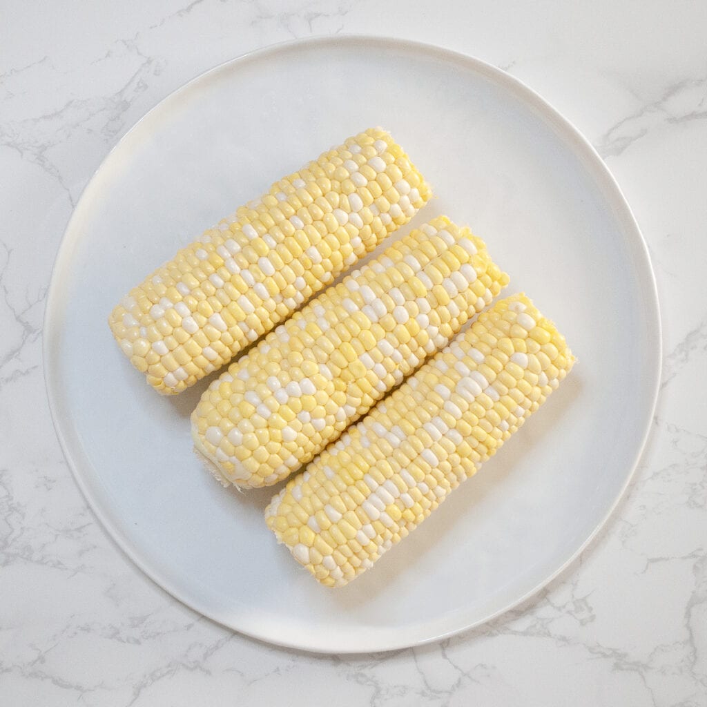 Uncooked Corns in a white plate