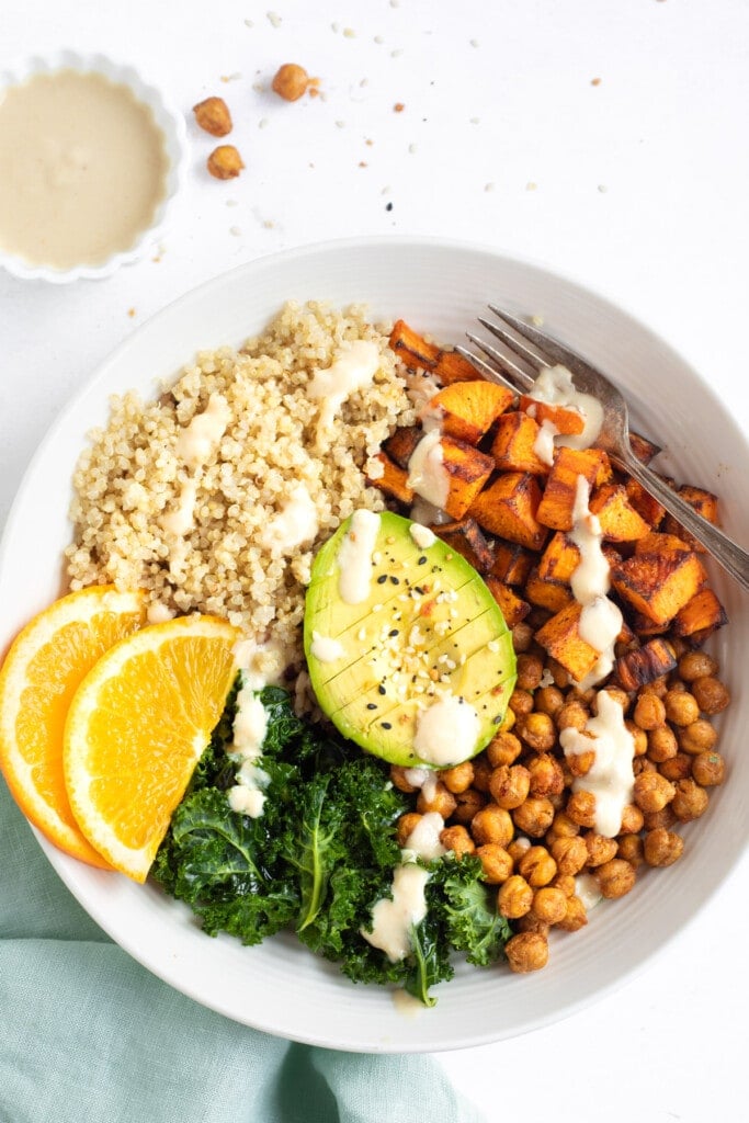 Healthy Vegan bowl with quinoa, sweet potato, chickpeas, kale and avocado