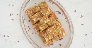 Homemade Magas sliced in square and garnished with petals