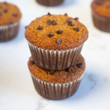 Paleo Pumpkin Muffins made with almond flour placed one over the other