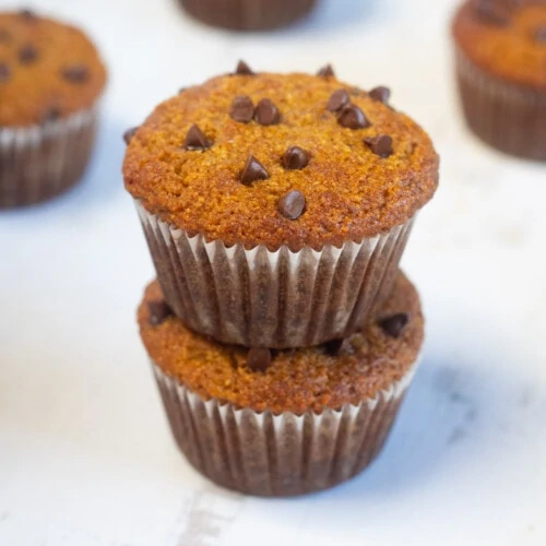 Paleo Pumpkin Muffins made with almond flour placed one over the other