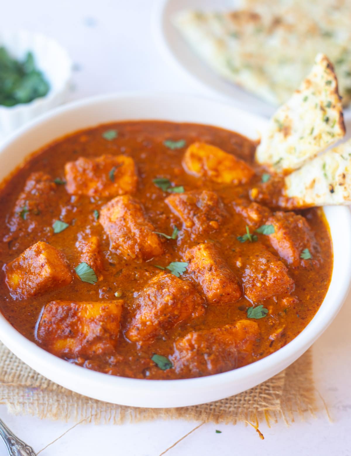 Spicy Paneer vindaloo with naan on the side