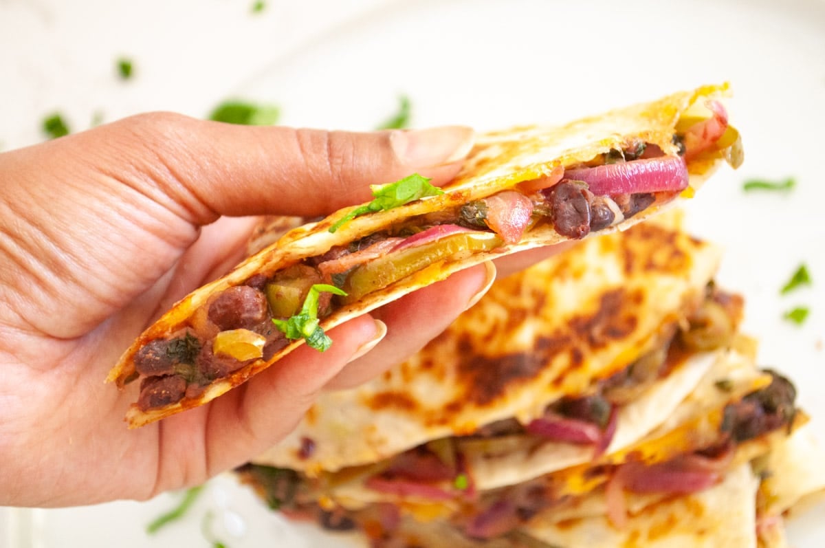 closeup of a vegetarian black bean quesadilla with fajita 