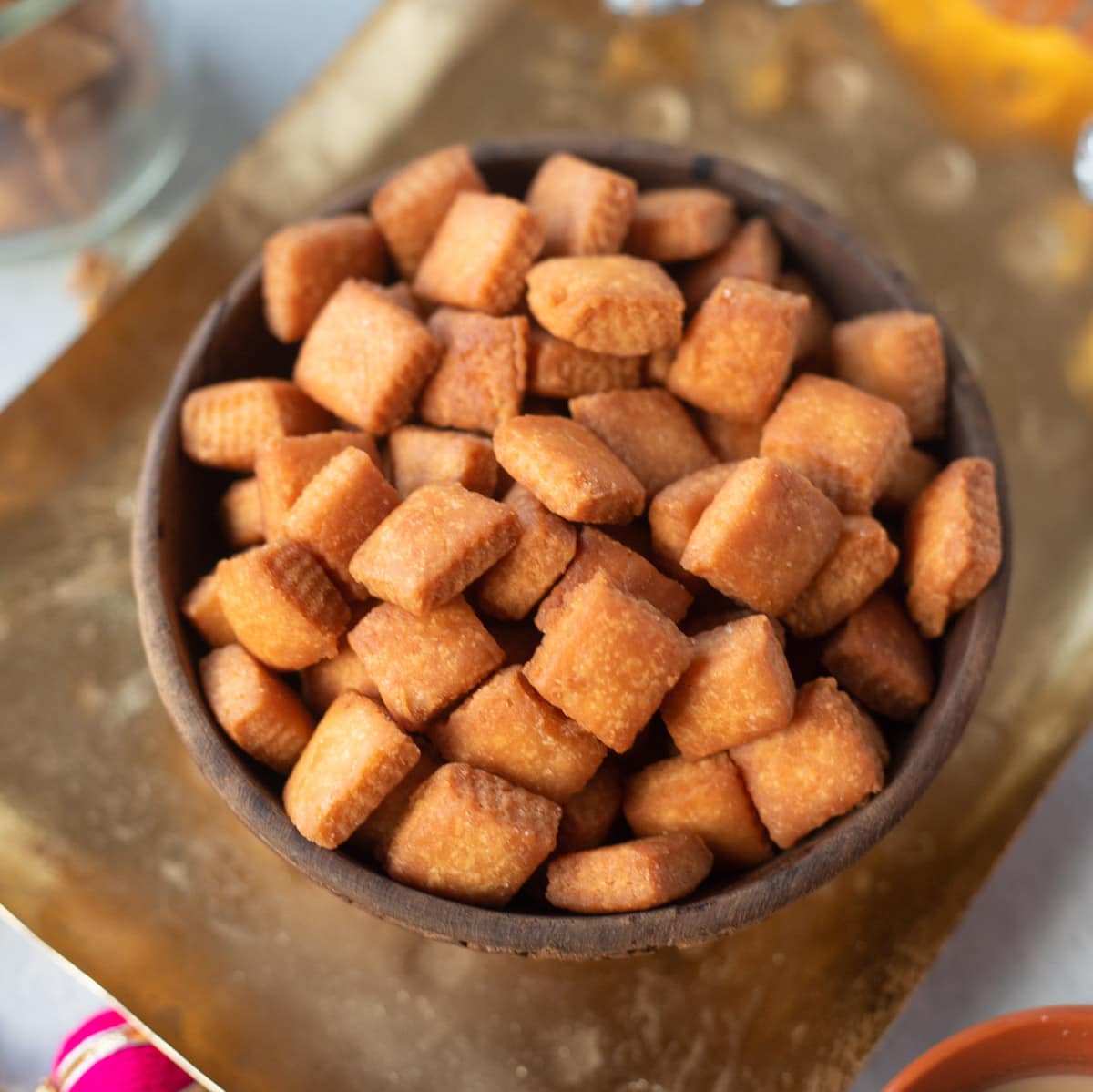 shakarpara in a bowl served on a tray