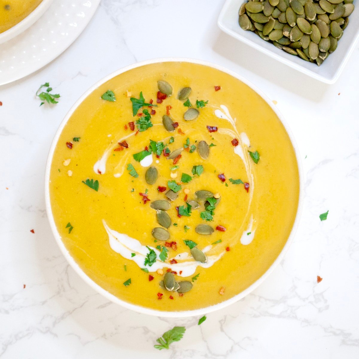 instant pot pumpkin soup in a white bowl