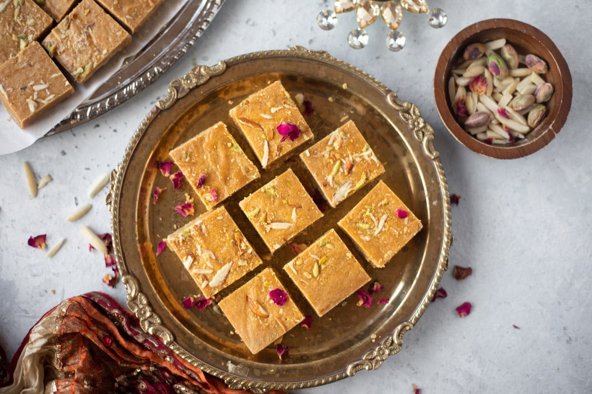 Besan burfi in a pretty plate served for a festive occasion