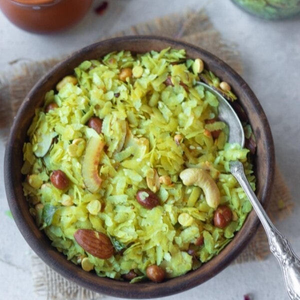 Poha Chivda in a wooden bowl served as a snack with chai