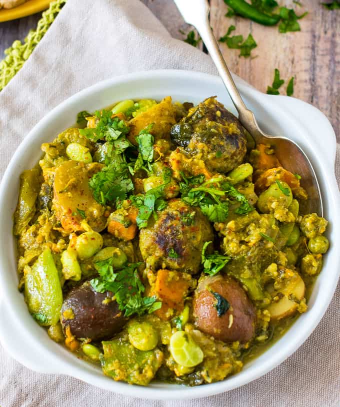 Undhiyu in a bowl garnished with cilantro 