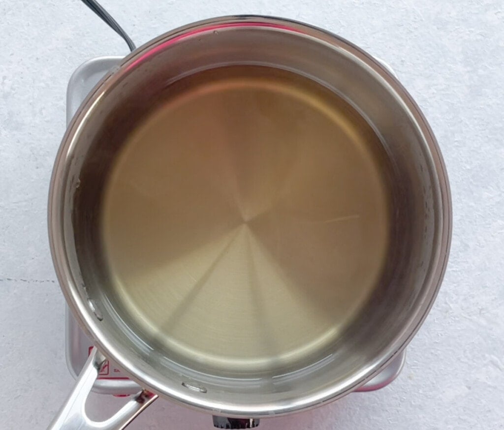sugar dissolved in water in a saucepan