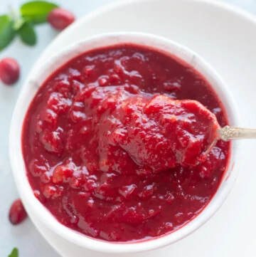 Cranberry chutney indian style in a bowl with a spoon