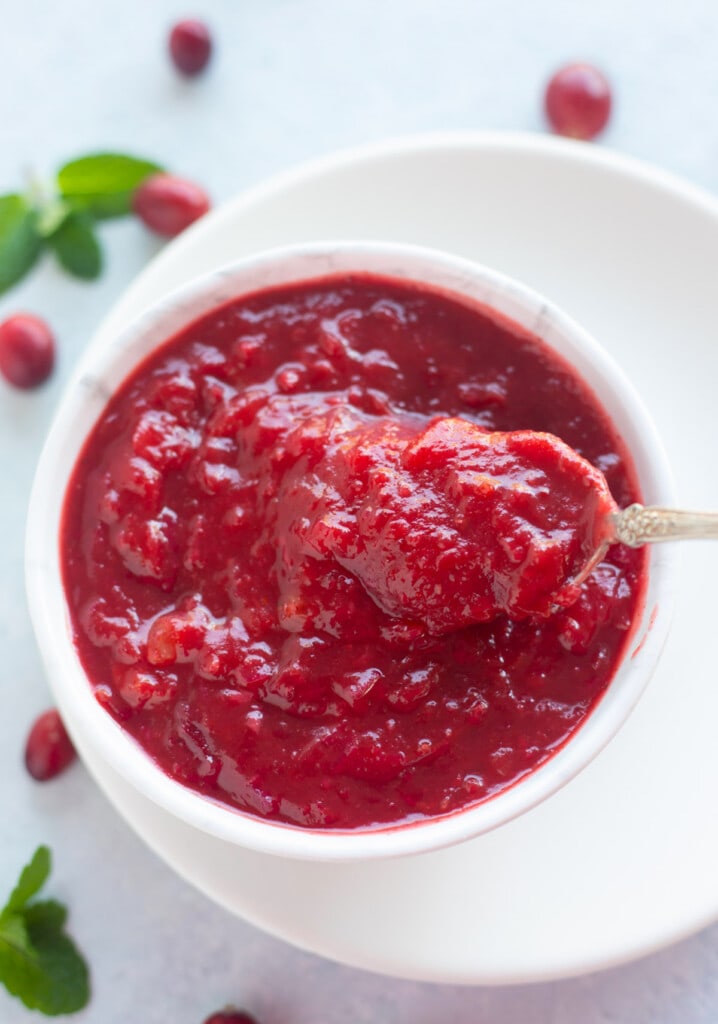 Cranberry chutney indian style in a bowl with a spoon