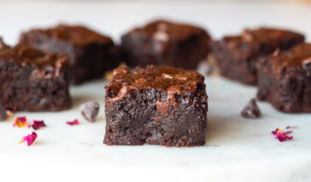 Fudgy gooey and moist almond flour brownies on a parchment paper 