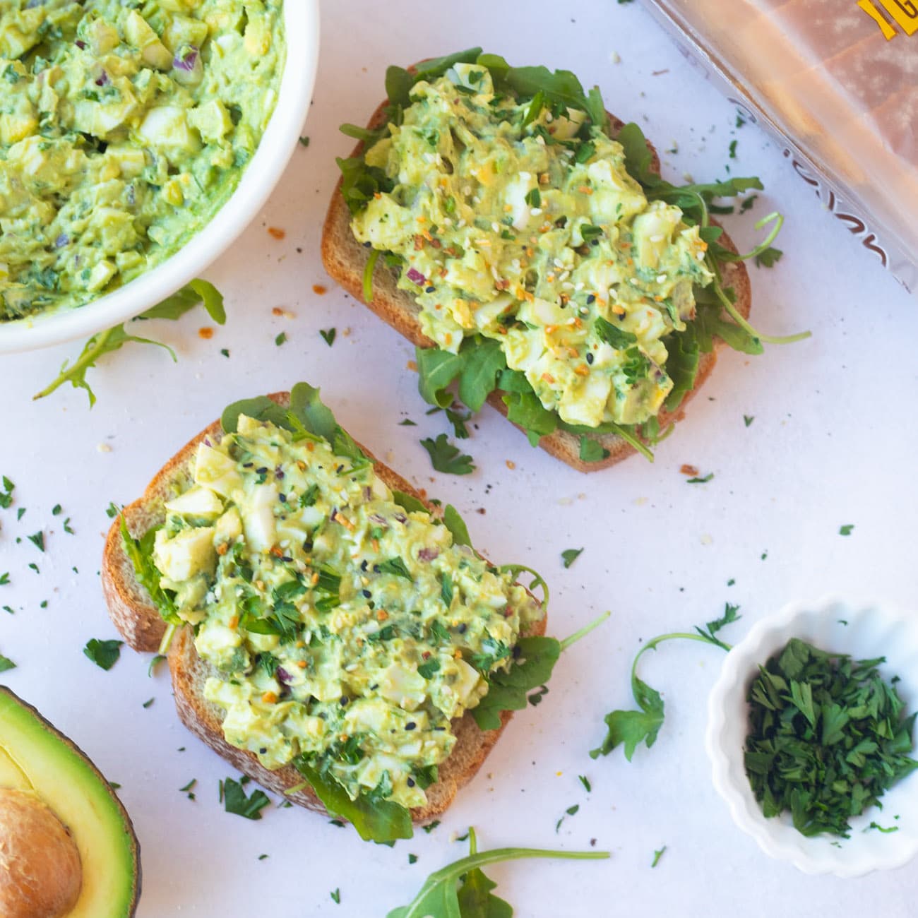 Avocado egg salad toast on a platter