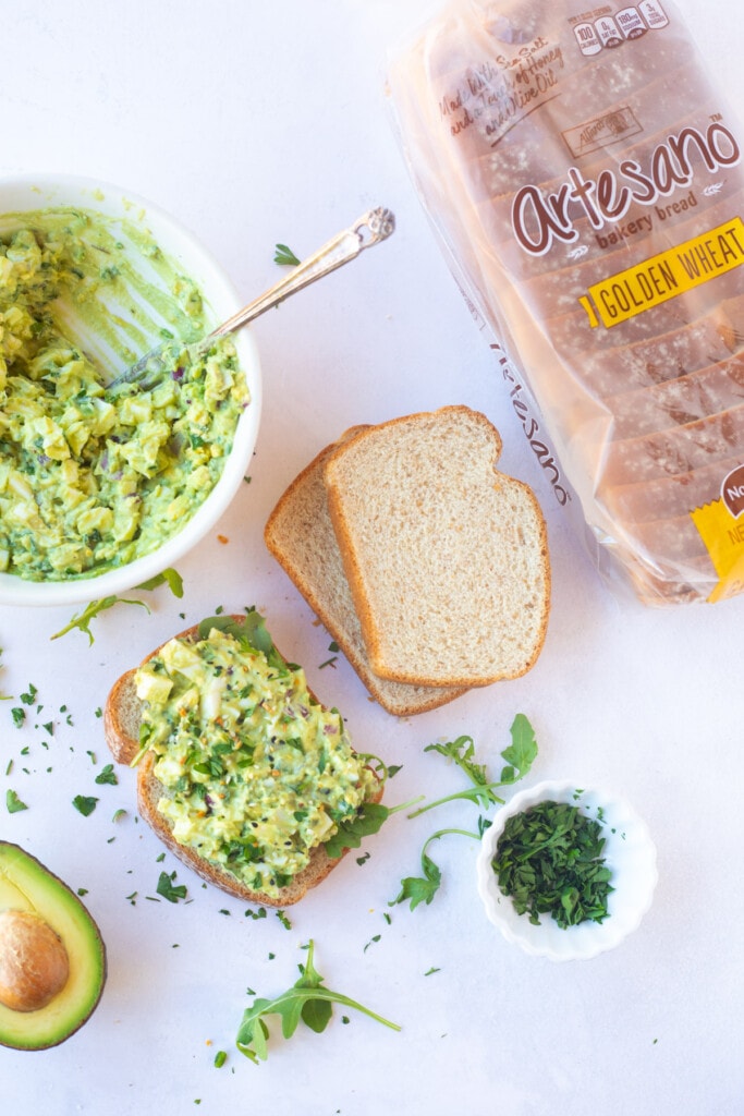 Avocado egg salad topped on a slice of bread 