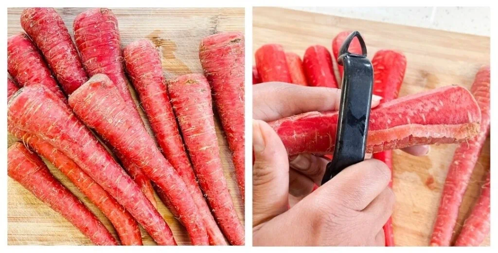 Peeling red carrots with a peeler