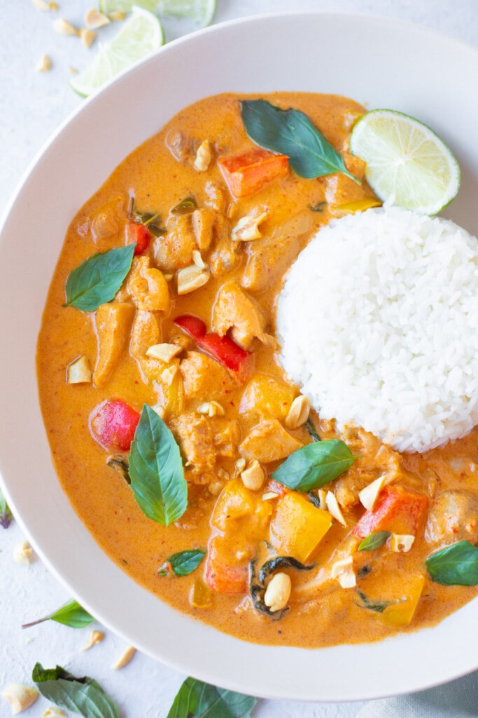 Thai Panang Curry with chicken served in a bowl with jasmine rice 
