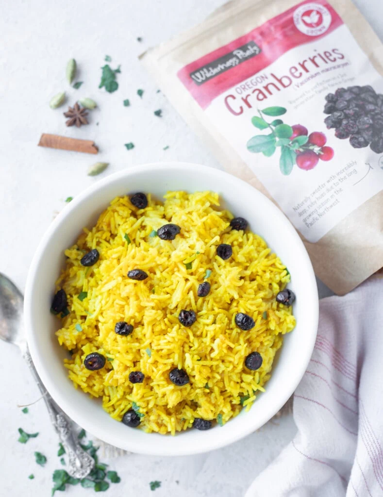 Yellow Turmeric rice topped with dried cranberries