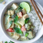 Thai Green Curry made in the instant pot served with jasmine rice in a white bowl