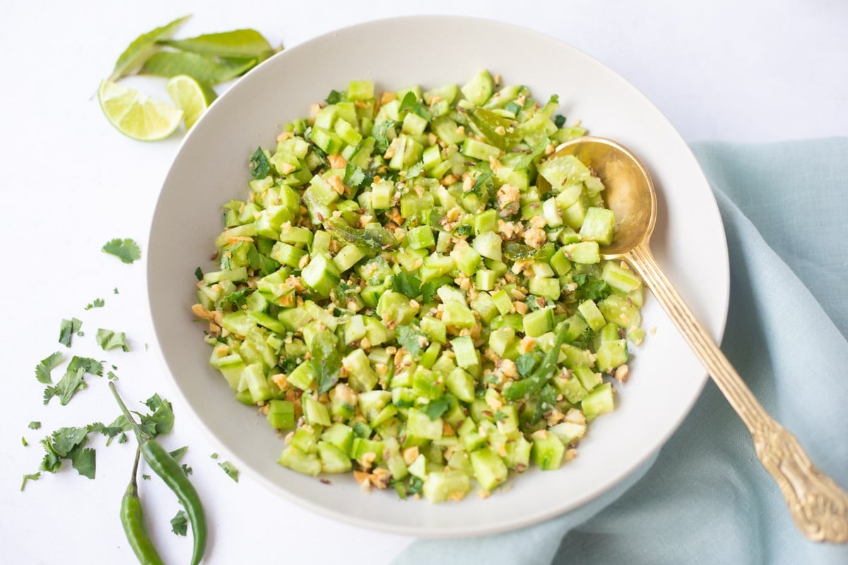 Khamang Kakdi, a spiced indian cucumber salad served in a bowl