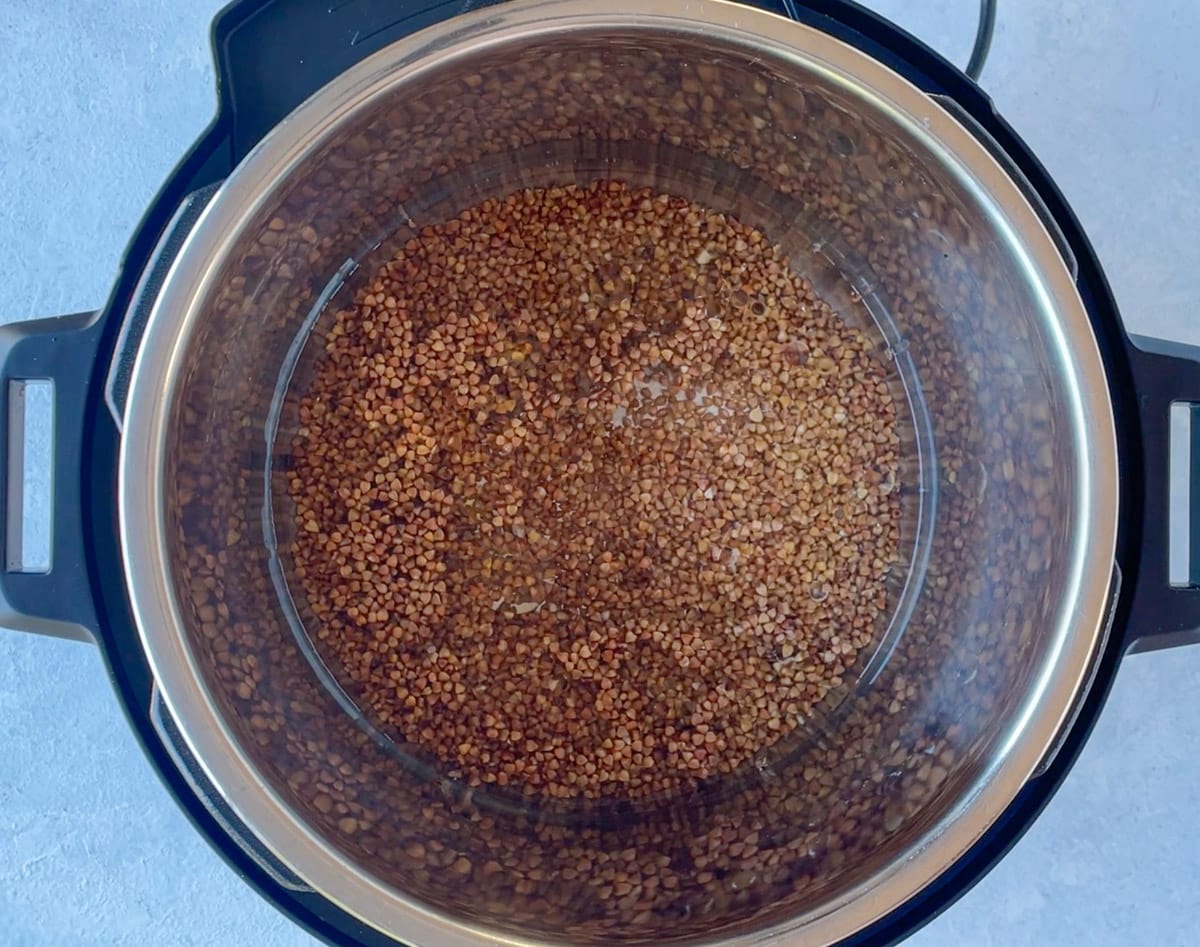 buckwheat with water ready to be cooked in the instant pot pressure cooker 