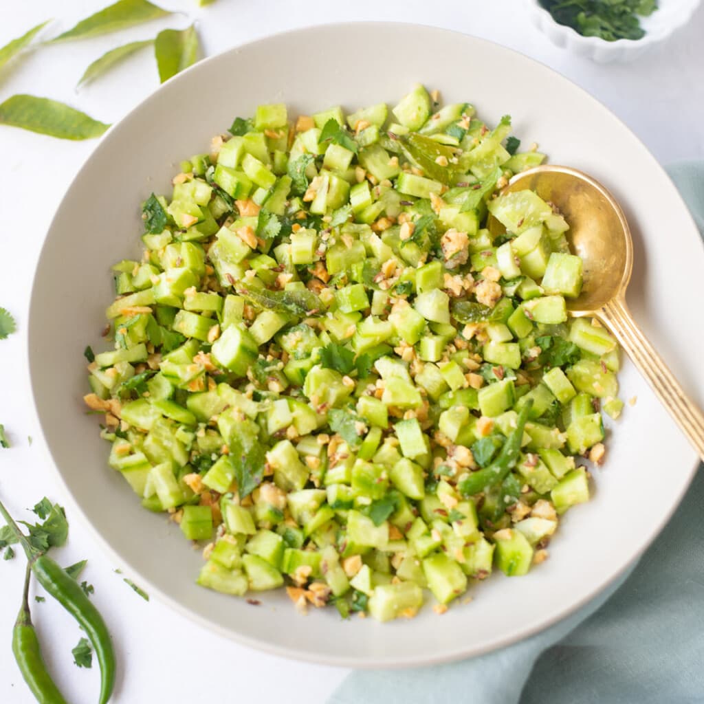 kakdi koshimbir, a spicy indian cucumber salad served in a bowl