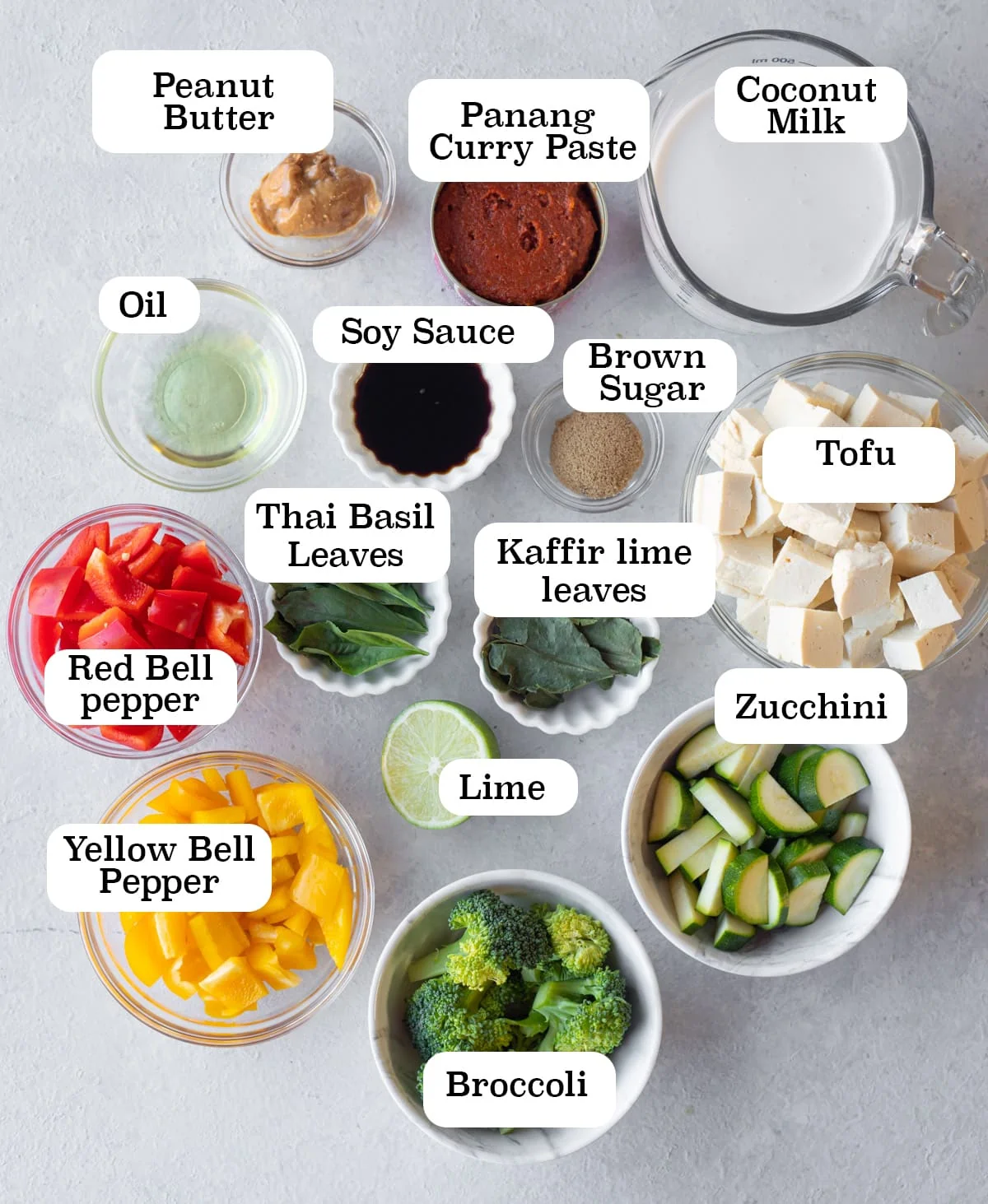 Ingredients to make vegan panang curry with tofu and vegetables