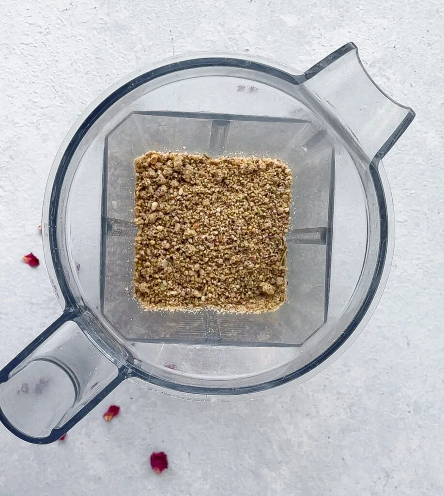 Ground Thandai powder in a grinder