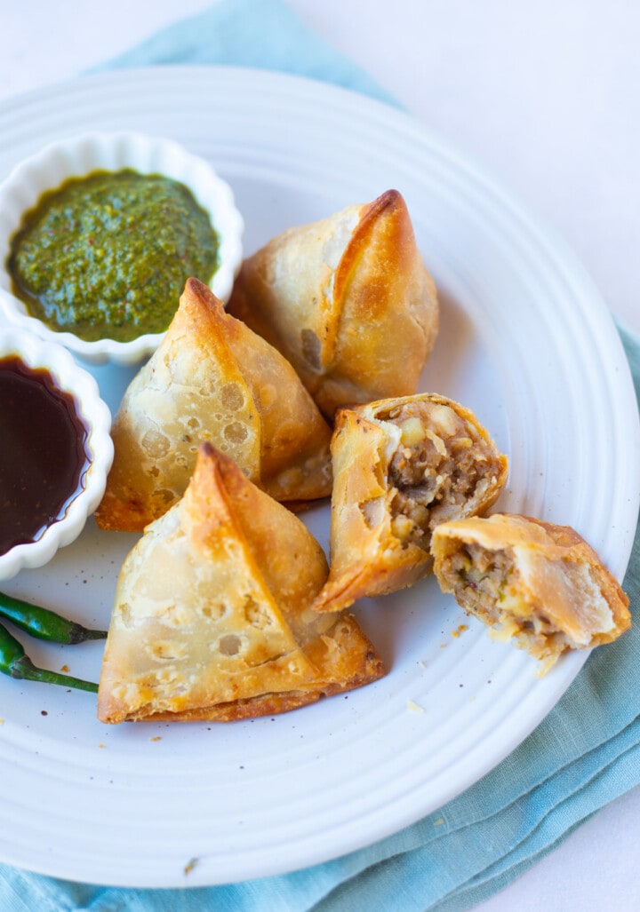 Air Fried Frozen Samosa in a plate served with chutneys