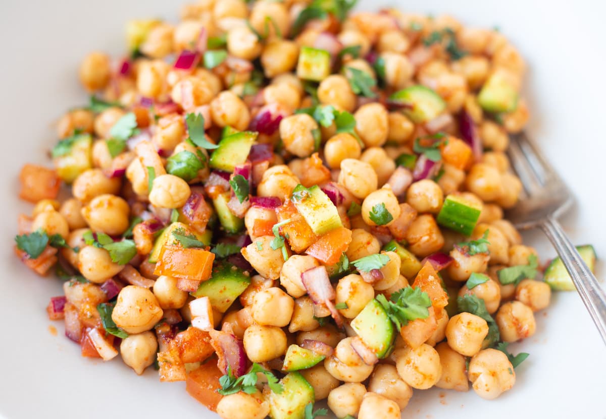 closeup of chickpea salad with veggies and spices