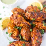 Indian Tandoori Wings served with a green dip