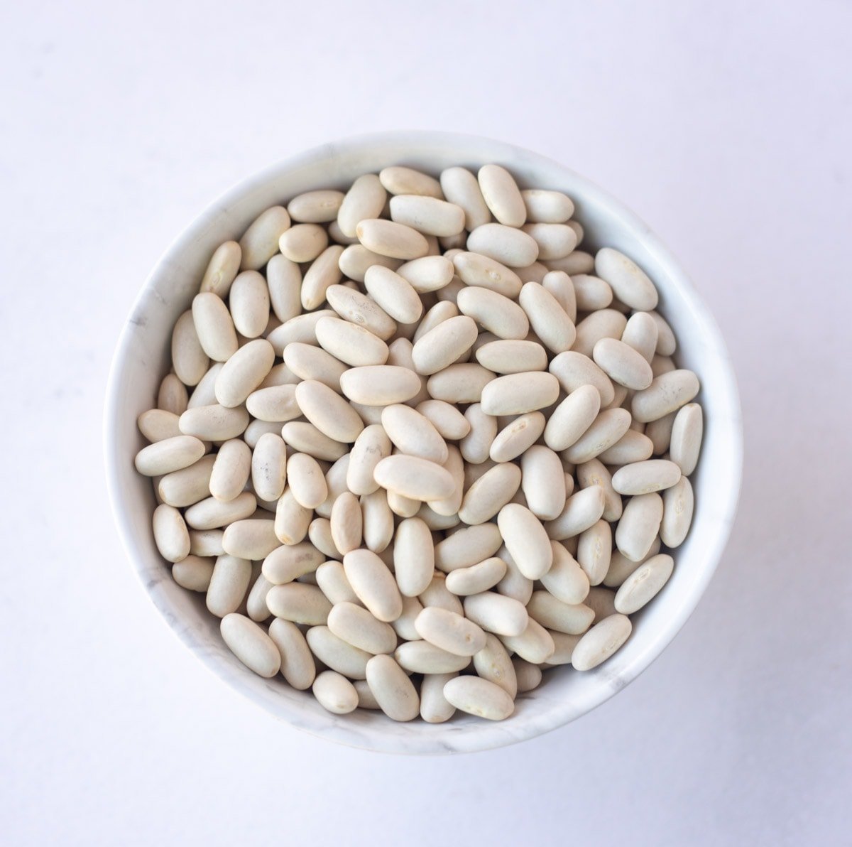 Dry Cannellini beans in a bowl 