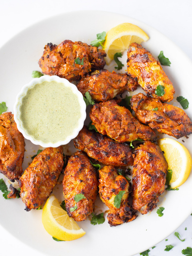 Indian Tandoori Wings served with a green dip
