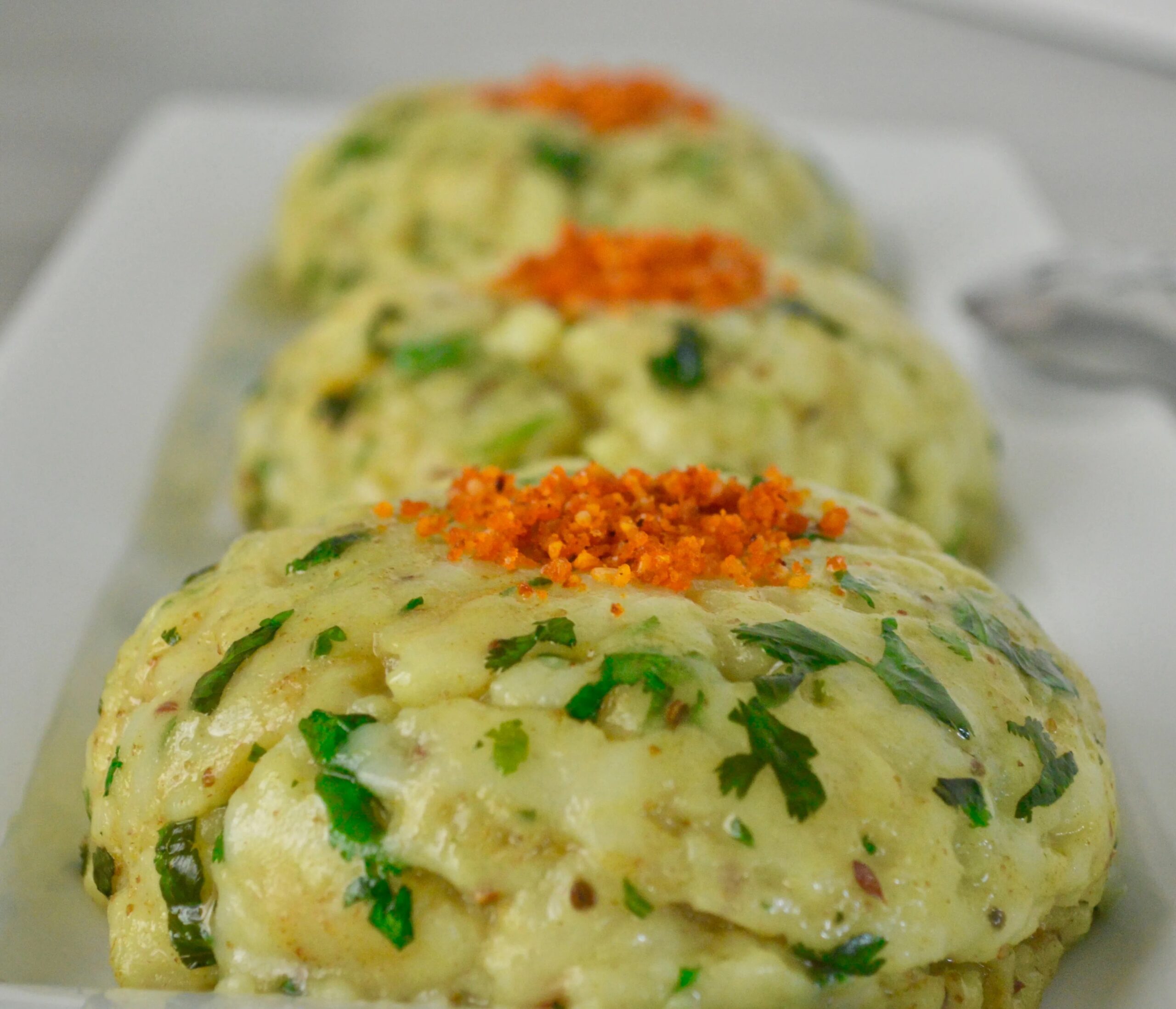 Khichiyu with cilantro in a serving plate