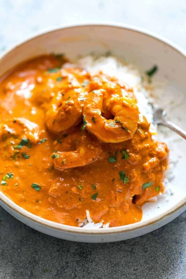 goan prawn curry with rice in a white bowl