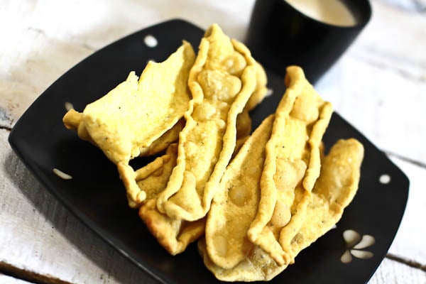 Gujarati fafda in a square black plate