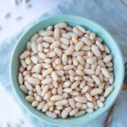 white beans in a bowl in front of the instant pot