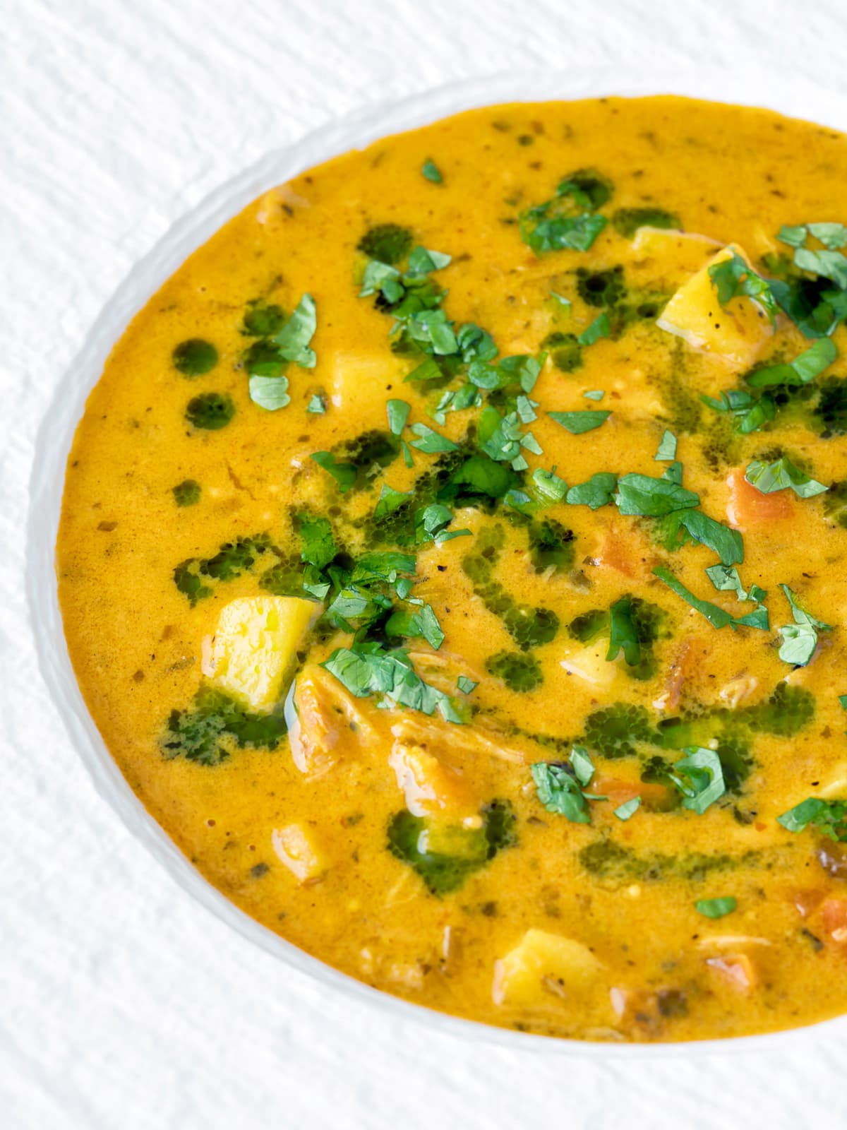 mulligatawny soup with coconut milk in a serving plate