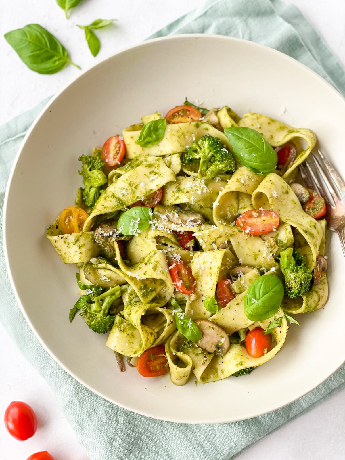 Pappardelle Pesto Pasta in a bowl garnished with basil leaves 