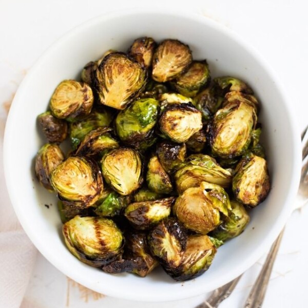 Roasted Air Fryer Brussels sprouts in a white bowl