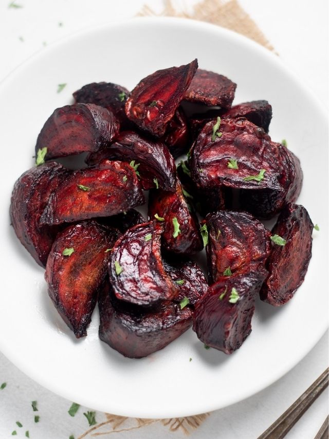 Perfectly Roasted beets served in a white plate with cilantro
