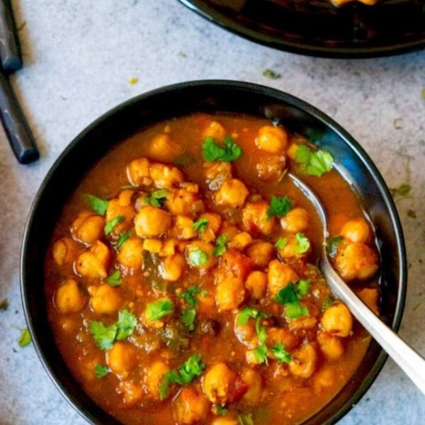 Chana Masala (Chickpea curry) served in a black bowl
