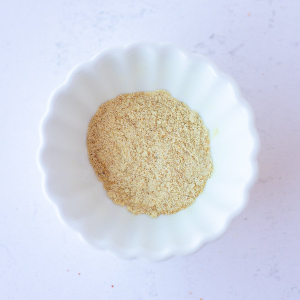Asafoetida in a small white bowl.