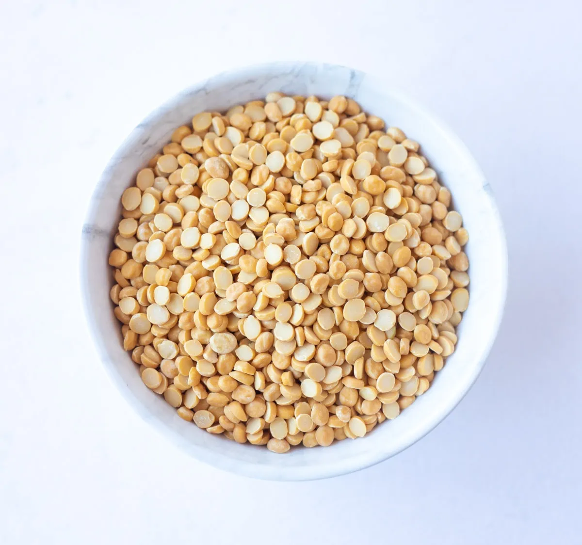 Bengal Gram, also called Chana Dal in a white bowl 